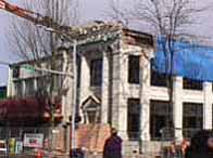 bank with part of roof broken off